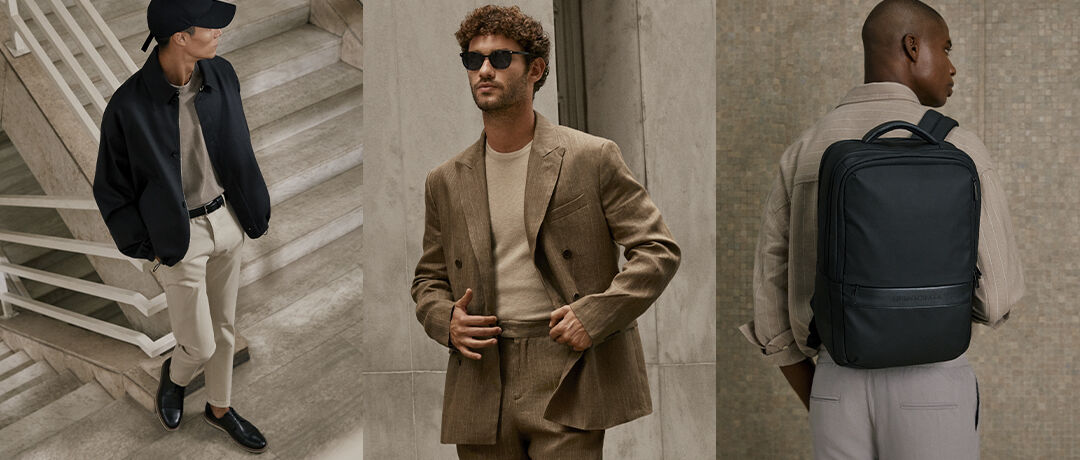 Homens com trajes elegantes e mochila em escadas