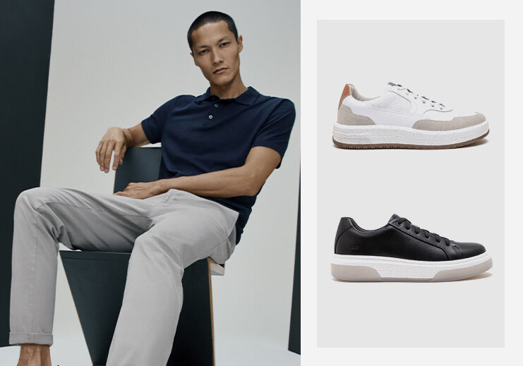 Homem com sapatos elegante sentado em uma cadeira.