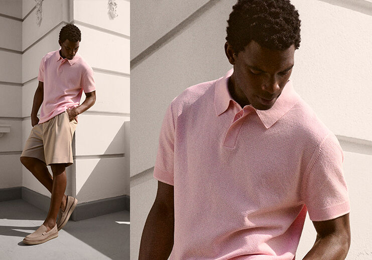 Homem usando camisa polo rosa e shorts claros